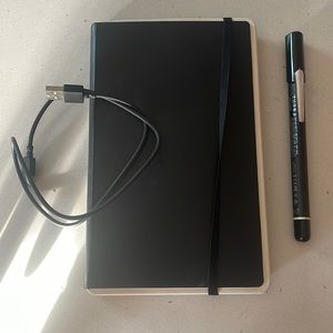 Moleskin pen+ smart pen with used notebook and charger
